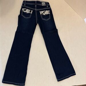 Cowgirl Hardware girls jeans. Size 6. Dark. Cow print on pocket. Boot cut.